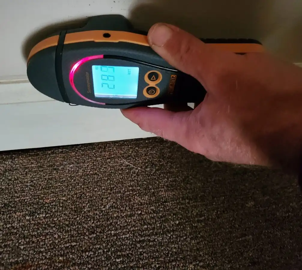 Moisture detection at baseboard during Storm Damage Restoration in Pine Castle
